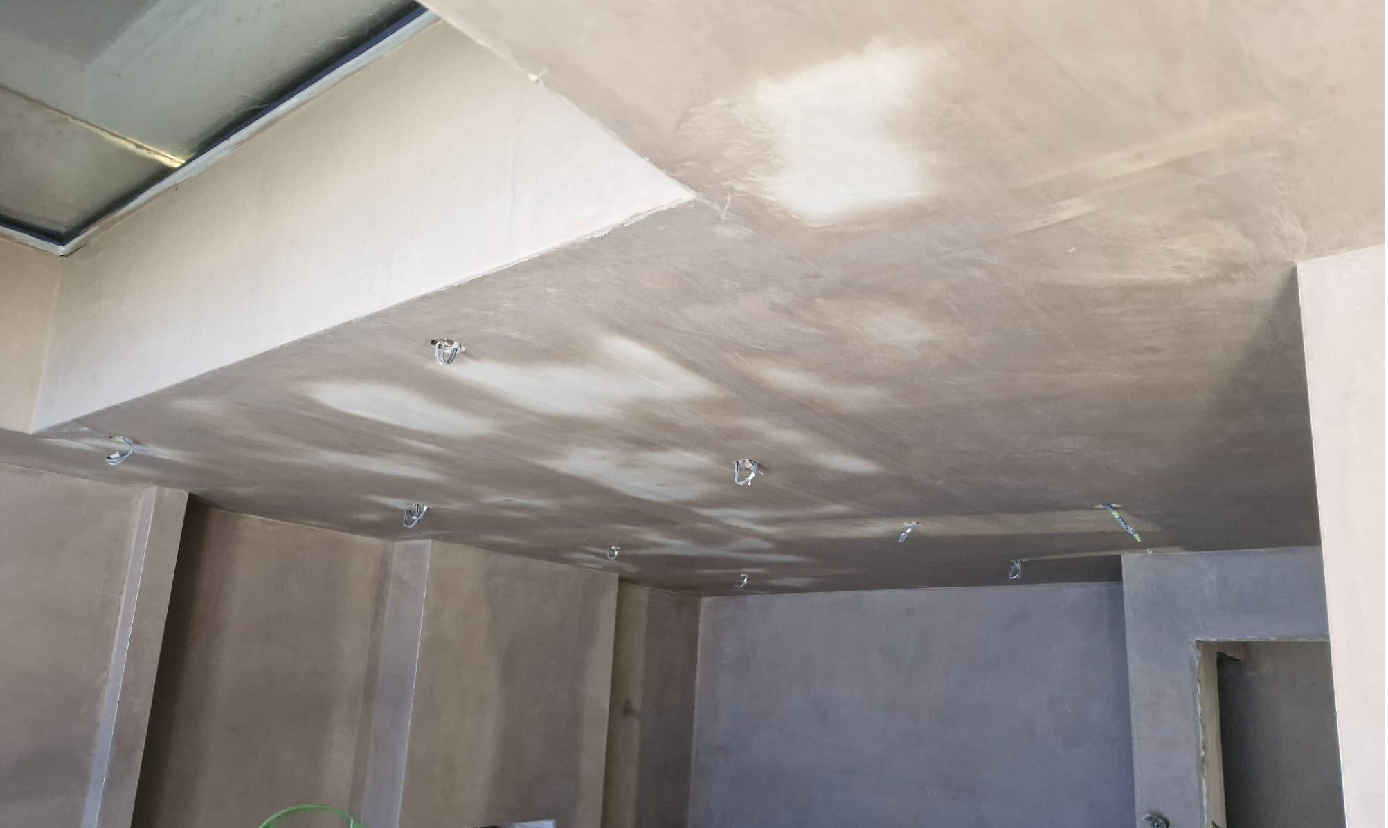 Freshly plastered room showing smooth finished walls and ceiling