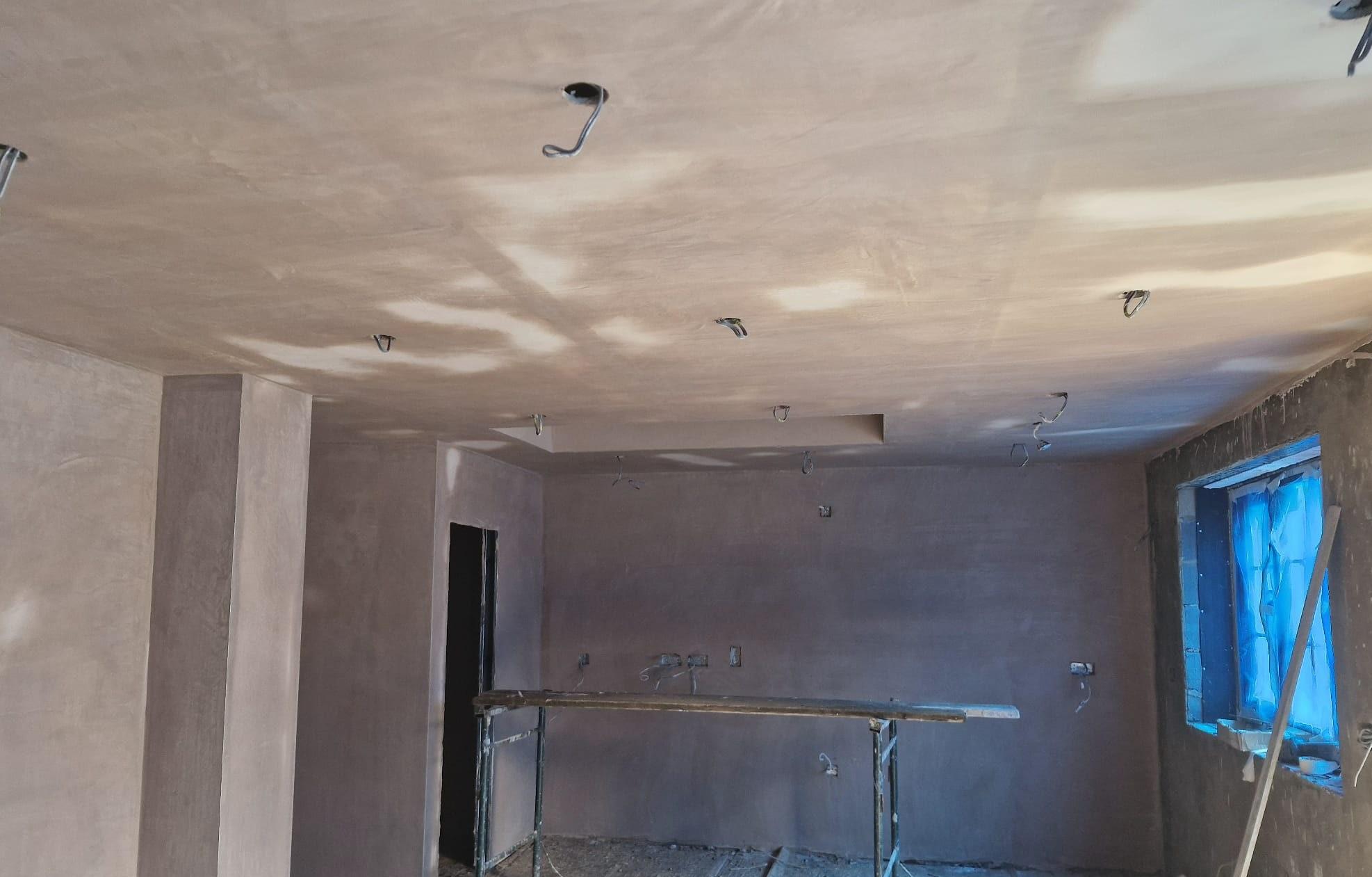 Freshly plastered room with ceiling and walls finished