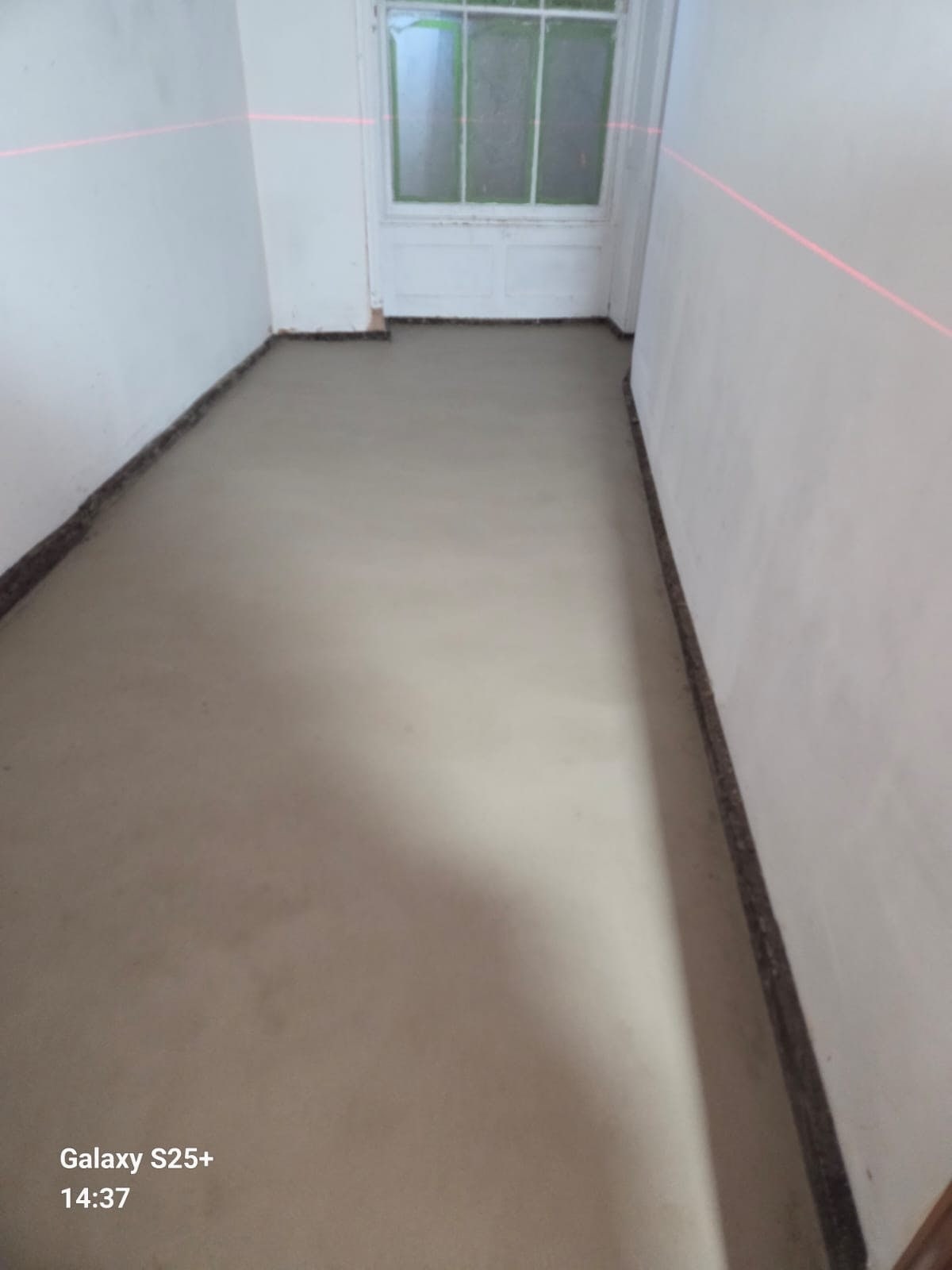 Freshly levelled floor screed in an interior room