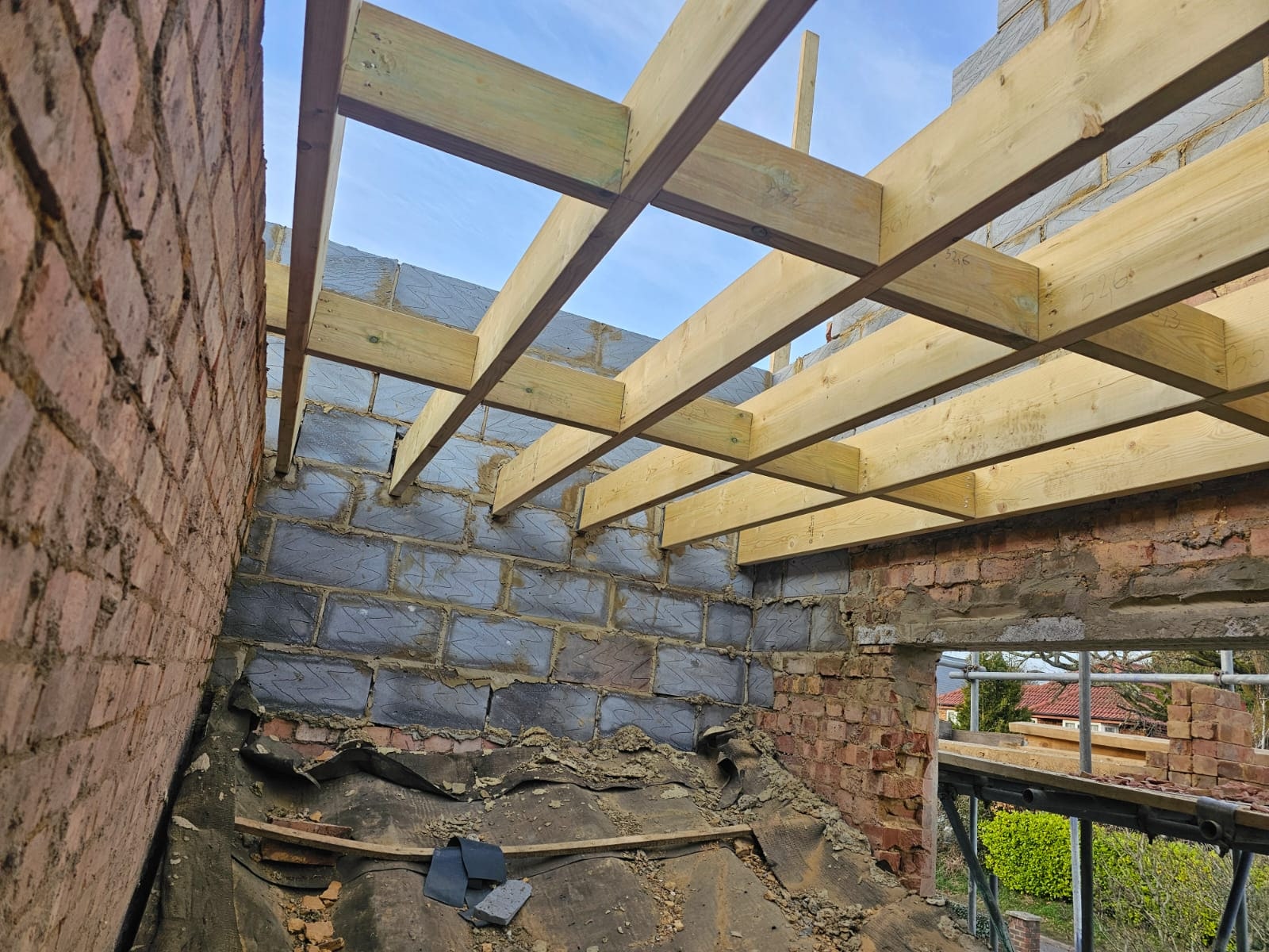 Timber roof structure installed above brickwork